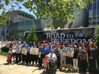 the ada legacy tour bus stands in front of the museum of natural sciences with excited members of the north carolina disability community