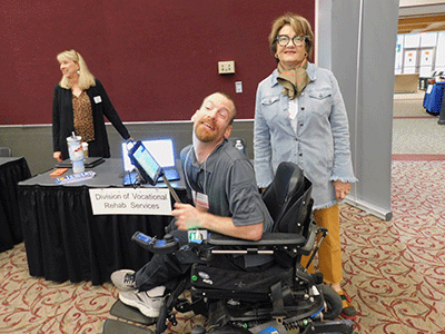 Brendon Hildreth with Jenny Pleasants from the NC Division of Vocational Rehabilitation Services (DVRS) at the North Carolina Assistive Technology (AT) Expo.